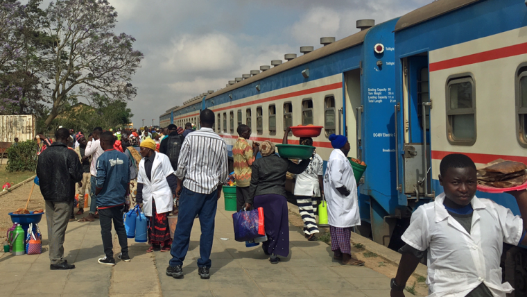 Vendors coming sell to passengers at a stop on the Tazara railway in Tanzania